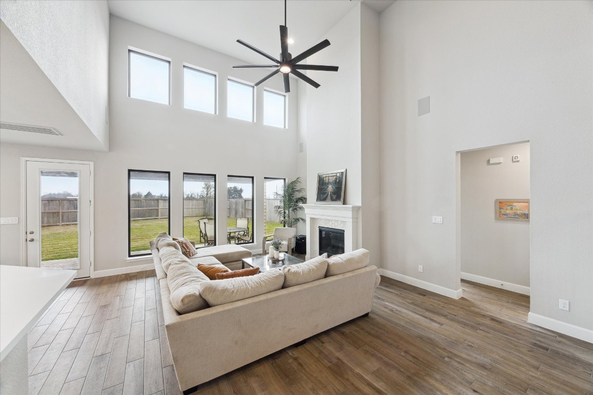 9951 Chapman Trail Manvel, TX 77578 - Photo 11 of 50 a living room with furniture and a large window with wooden floor