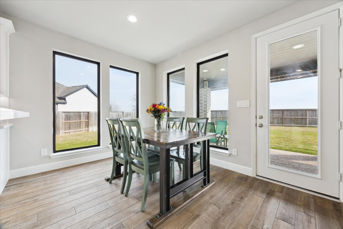 9951 Chapman Trail Manvel, TX 77578 - Photo 17 of 50 a dining room with furniture window wooden floor