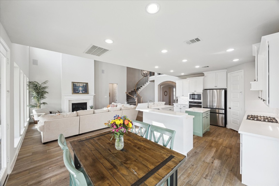 9951 Chapman Trail Manvel, TX 77578 - Photo 18 of 50 a large kitchen with a table and chairs