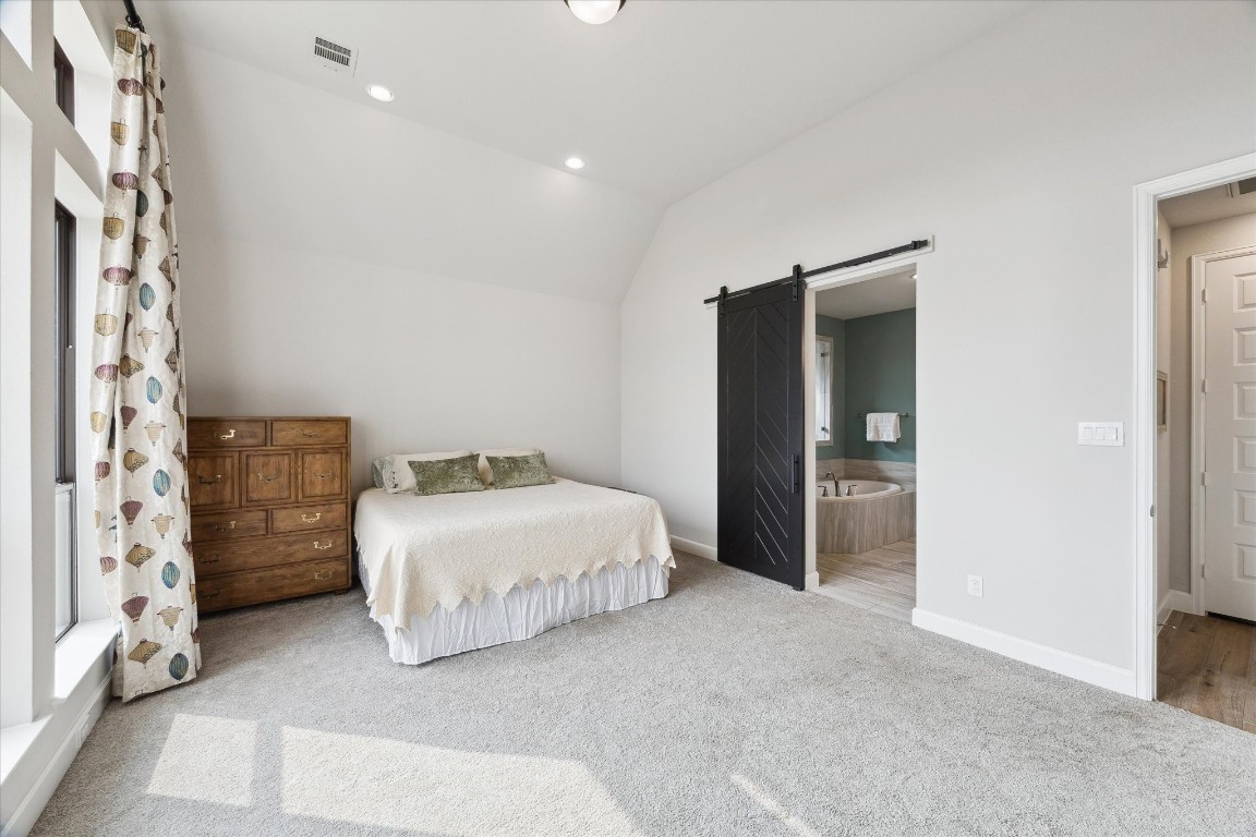 9951 Chapman Trail Manvel, TX 77578 - Photo 20 of 50 a spacious bedroom with a bed and a cabinets