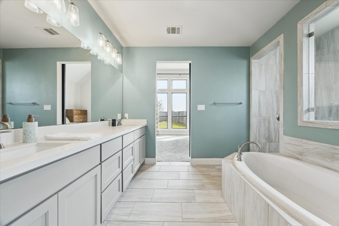9951 Chapman Trail Manvel, TX 77578 - Photo 22 of 50 a spacious bathroom with sink shower and a bathtub