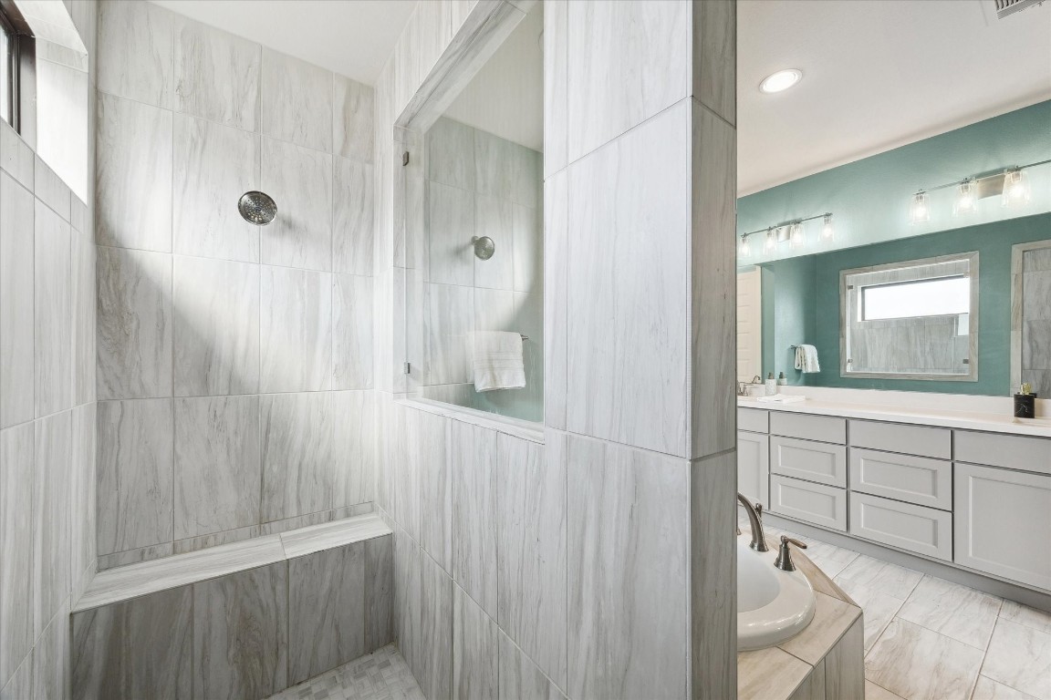 9951 Chapman Trail Manvel, TX 77578 - Photo 23 of 50 a bathroom with a shower a sink and a mirror