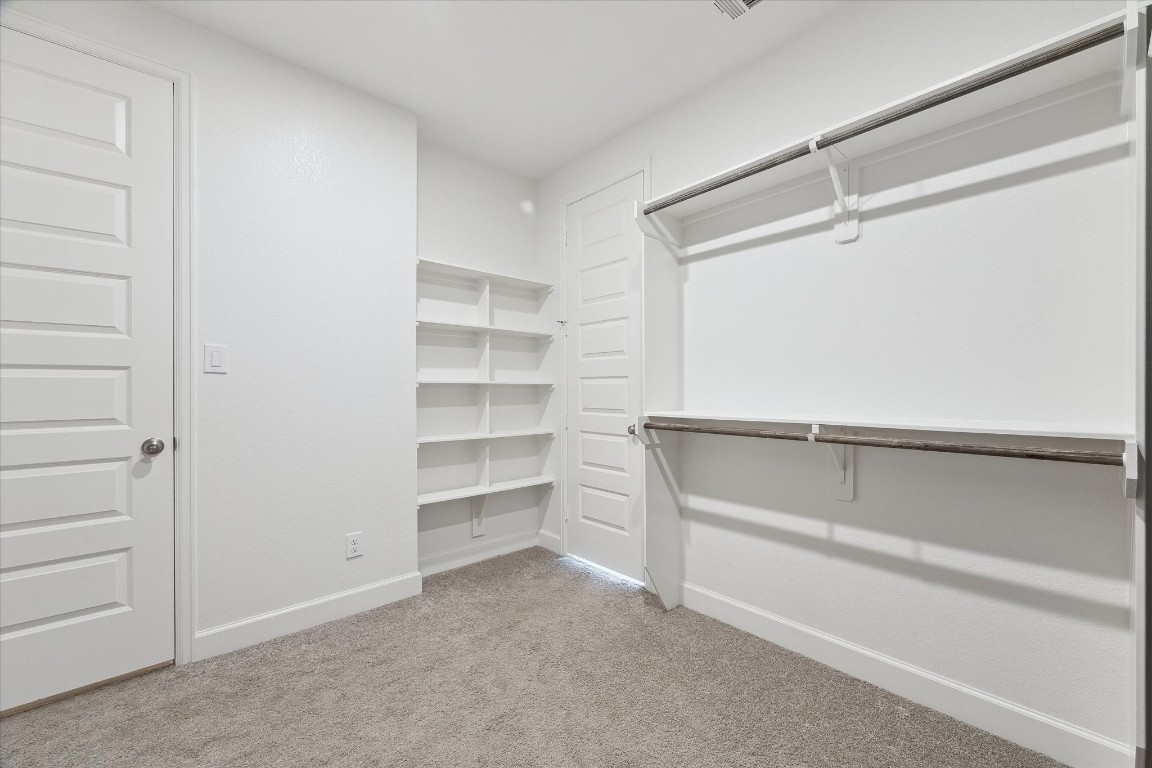 9951 Chapman Trail Manvel, TX 77578 - Photo 24 of 50 a view of an empty walk in closet