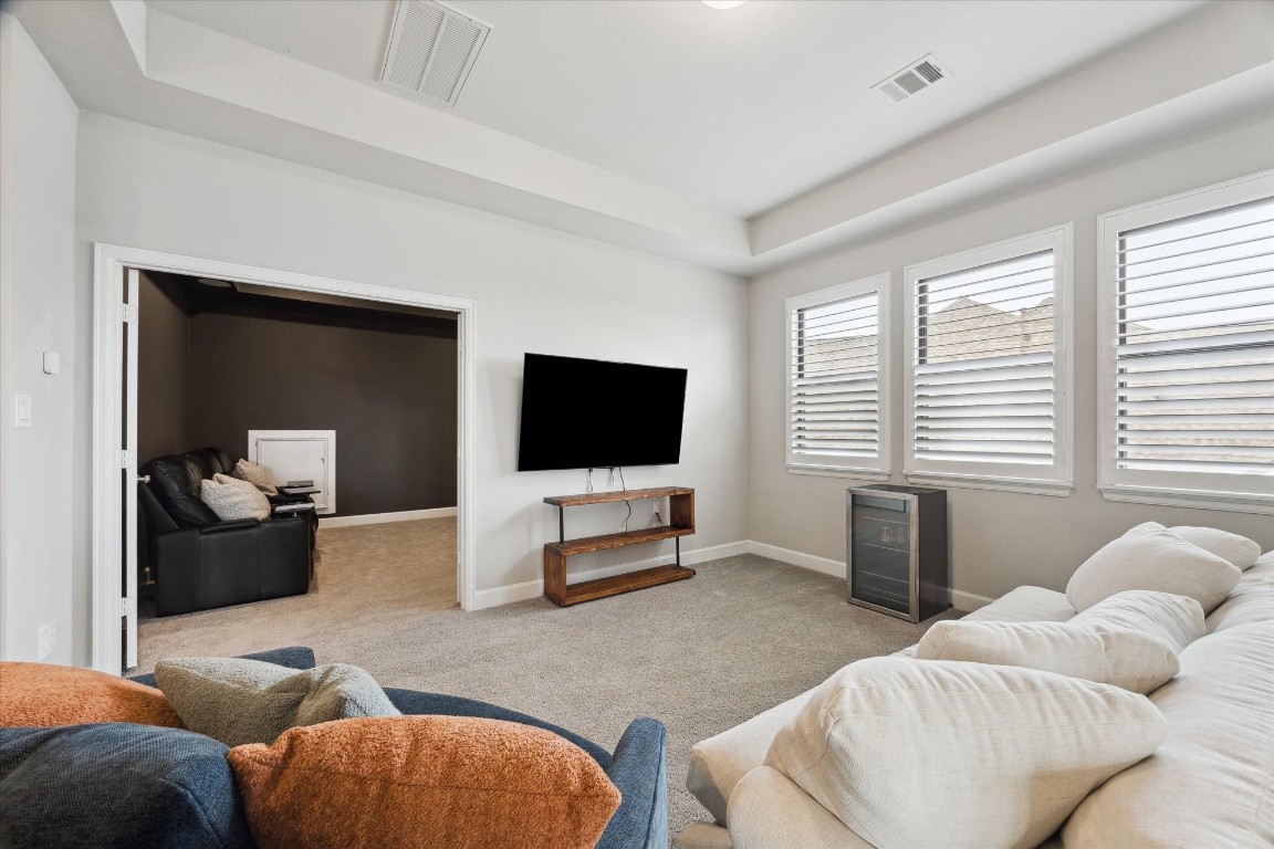 9951 Chapman Trail Manvel, TX 77578 - Photo 29 of 50 a living room with furniture and a flat screen tv