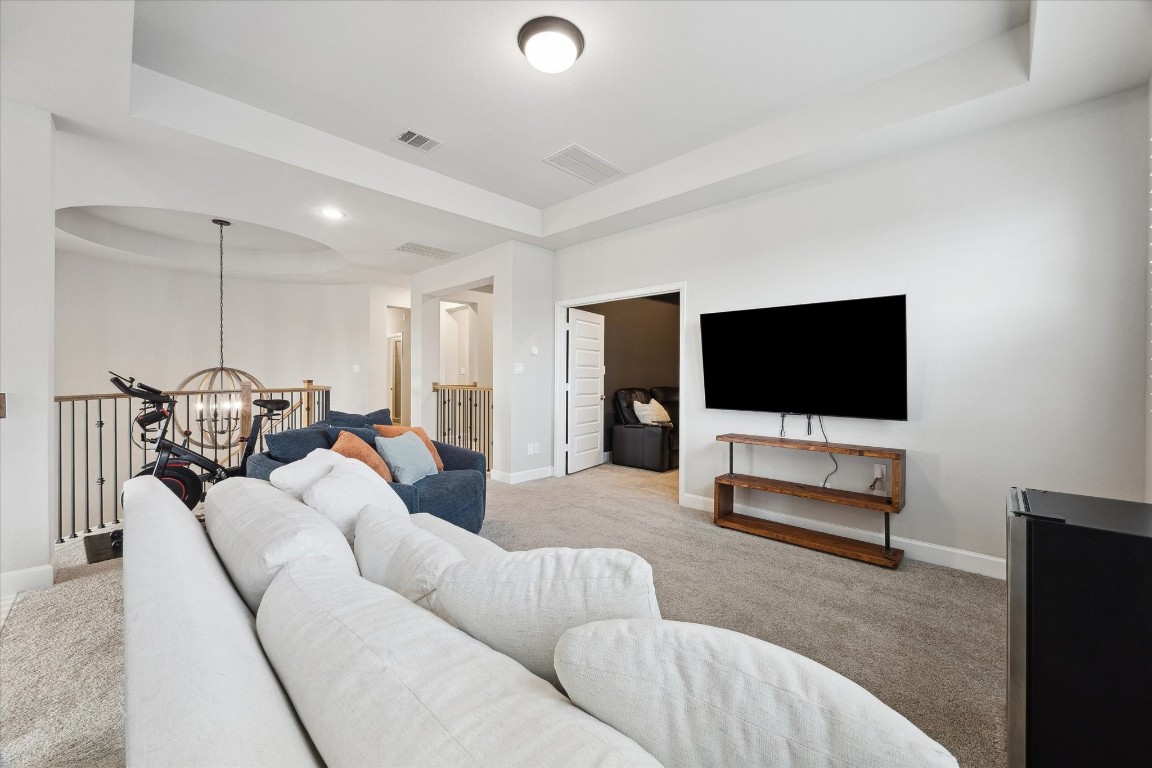 9951 Chapman Trail Manvel, TX 77578 - Photo 30 of 50 a living room with furniture and a flat screen tv