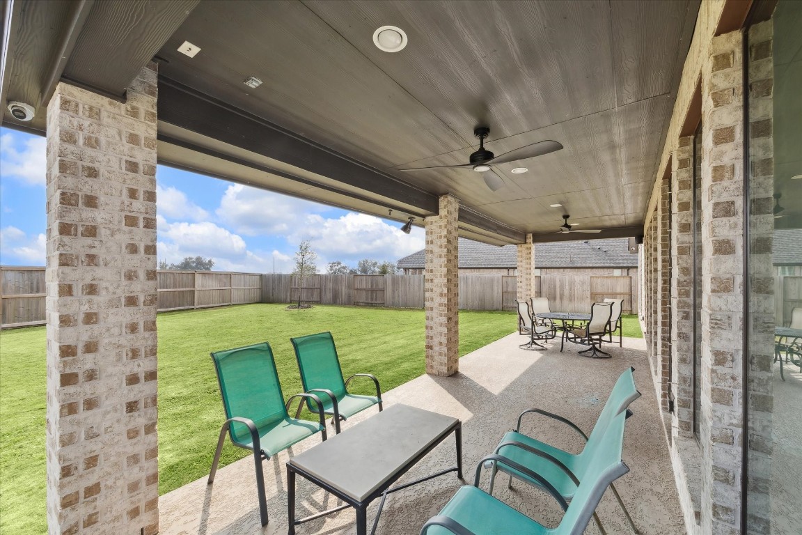 9951 Chapman Trail Manvel, TX 77578 - Photo 37 of 50 a patio with table and chairs