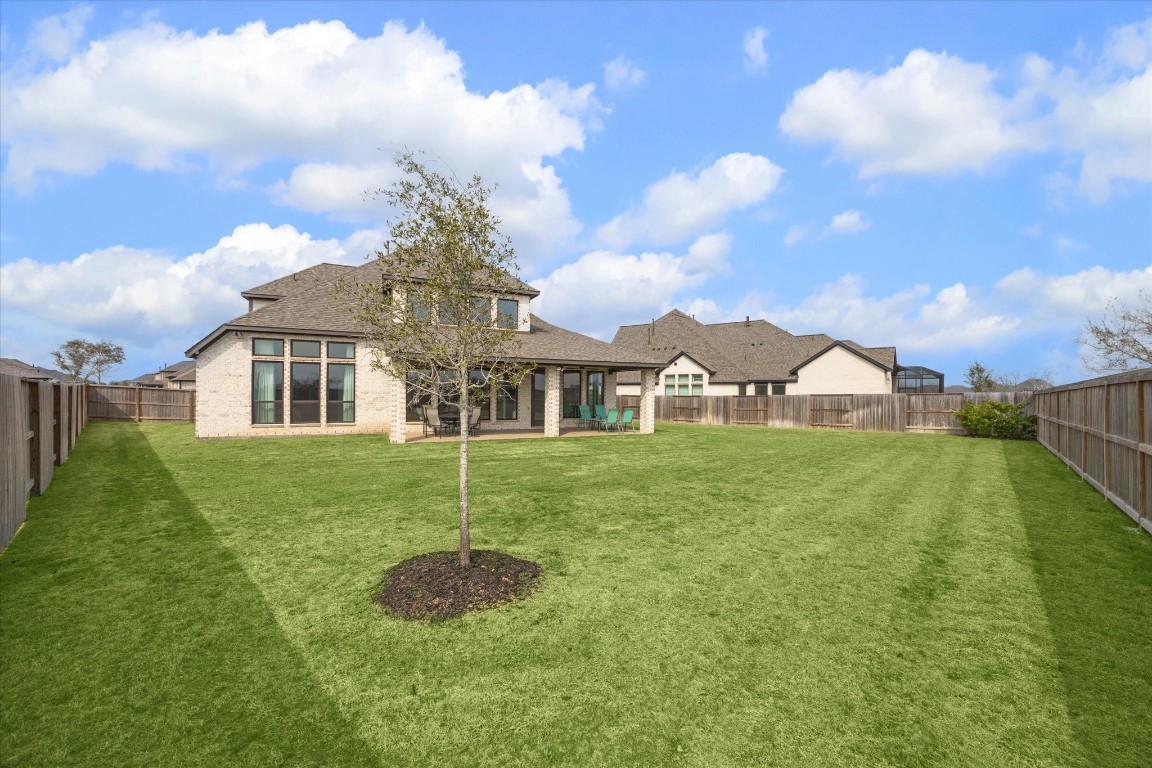 9951 Chapman Trail Manvel, TX 77578 - Photo 38 of 50 a front view of a house with a yard
