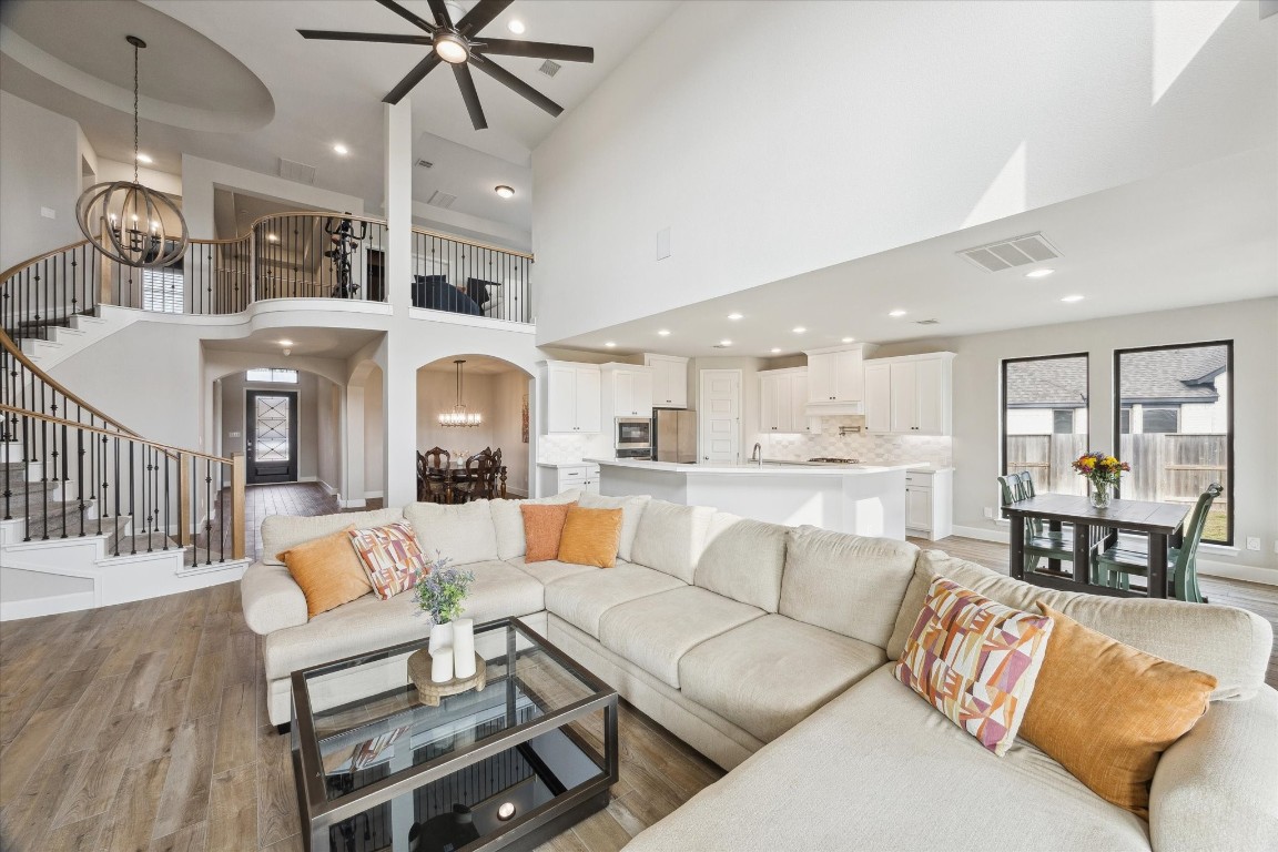 9951 Chapman Trail Manvel, TX 77578 - Photo 10 of 50 a living room with furniture kitchen view and a chandelier