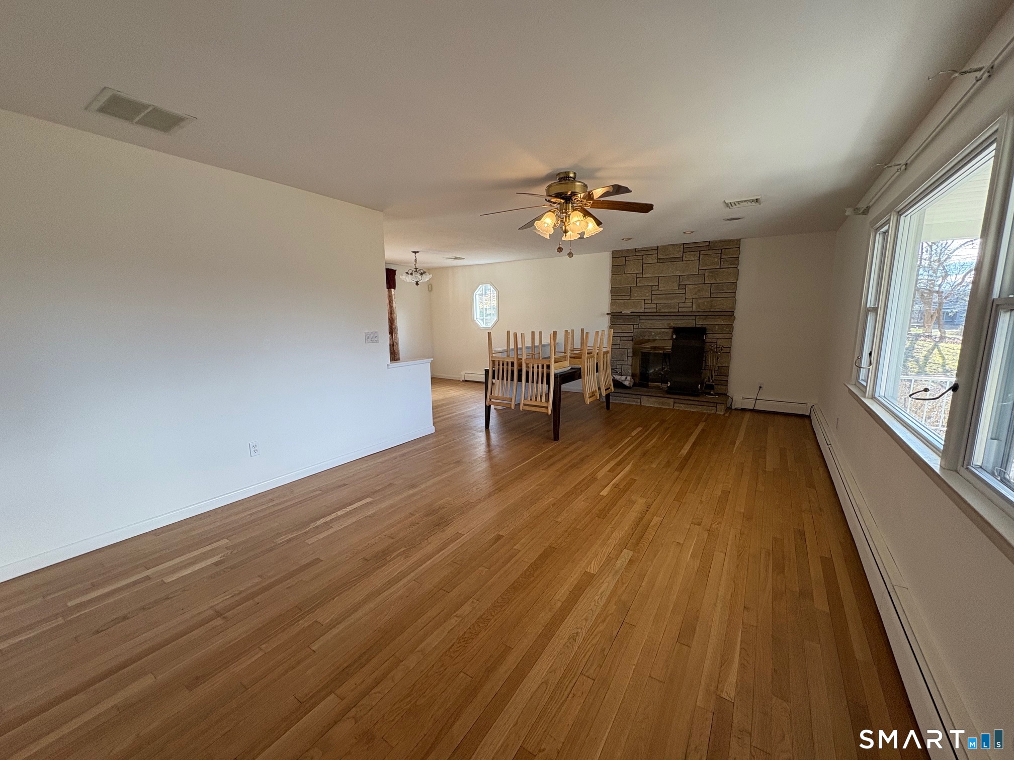 967 Derby-Milford Road Orange, CT 06477 - Photo 10 of 24 wooden floor in an empty room with a window