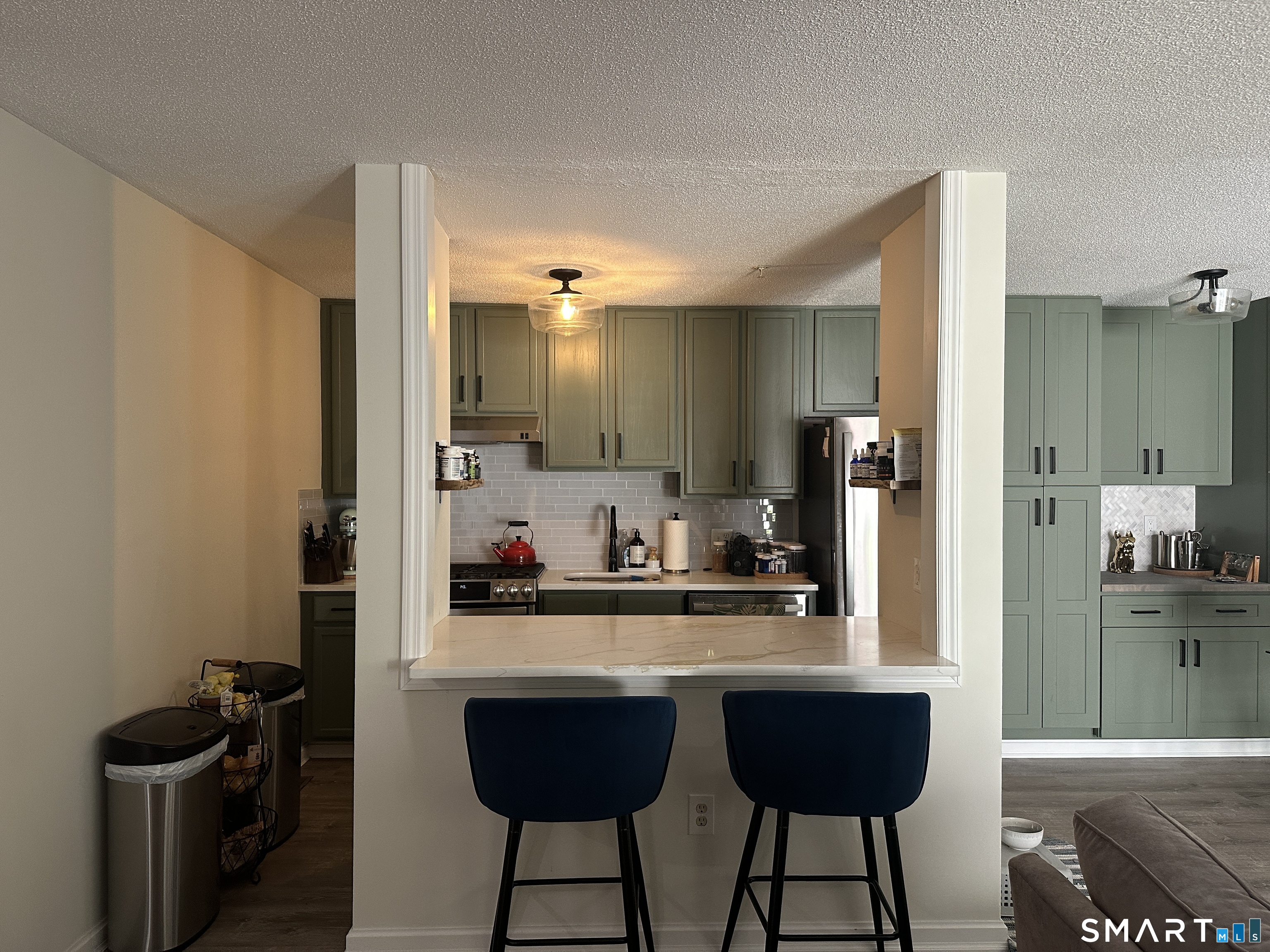 10 Sugar Maple Lane, Unit 10 Ridgefield, CT 06877 - Photo 2 of 13 a kitchen with a table and chairs in it