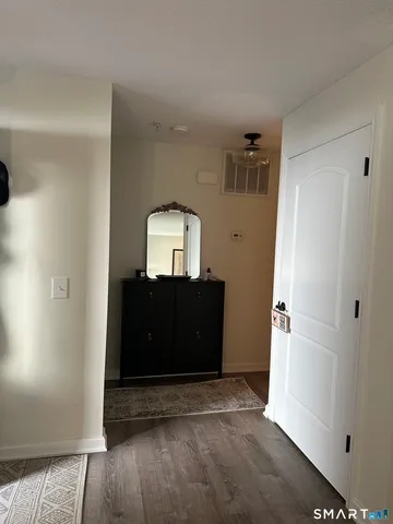 a view of a hallway with front door