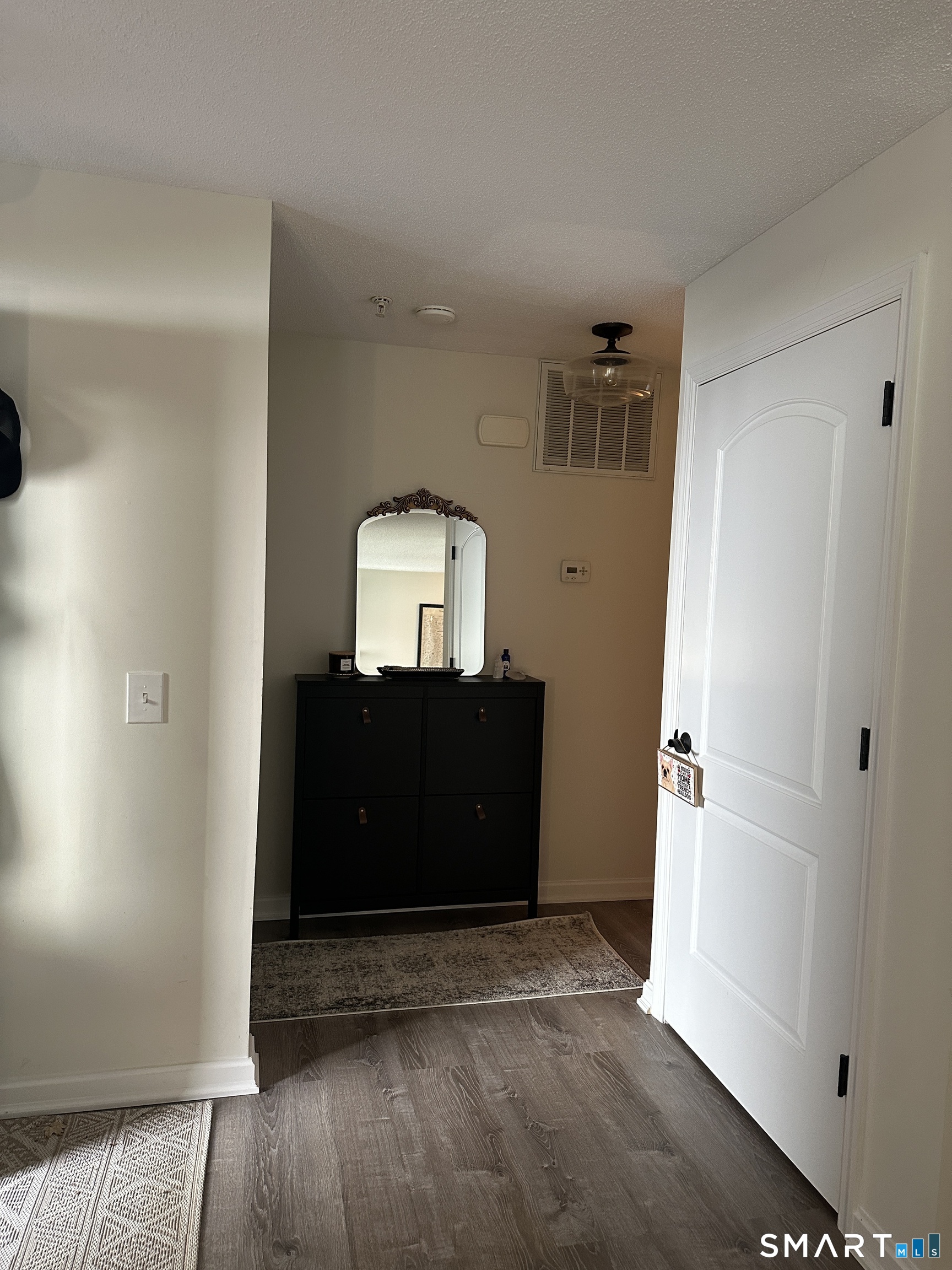 10 Sugar Maple Lane, Unit 10 Ridgefield, CT 06877 - Photo 10 of 13 a view of a hallway with front door