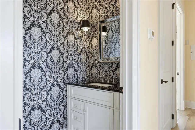 a bathroom with a shower curtain and a sink