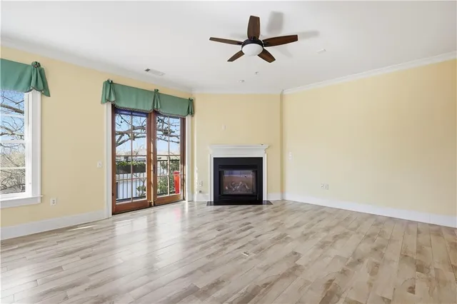 a view of a livingroom with a fireplace and window