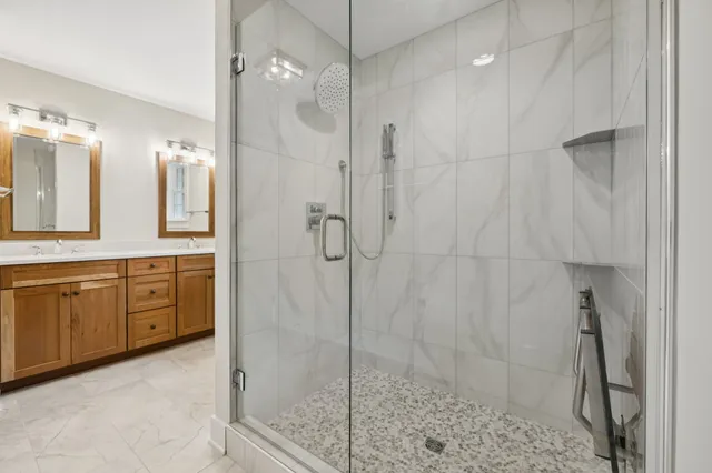 a bathroom with a shower and a sink