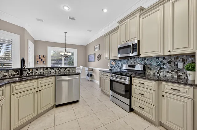 a living room with furniture ceiling fan and a window