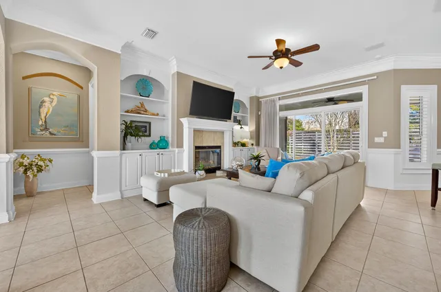 a spacious bedroom with a bed and a flat screen tv