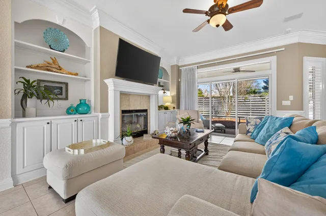 a spacious bedroom with a bed and a chandelier