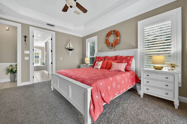 a bathroom with a granite countertop sink a toilet and shower