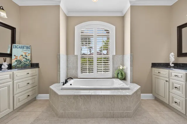 a living room with furniture a flat screen tv and a window