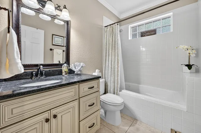 a view of a building with a tree in front of it