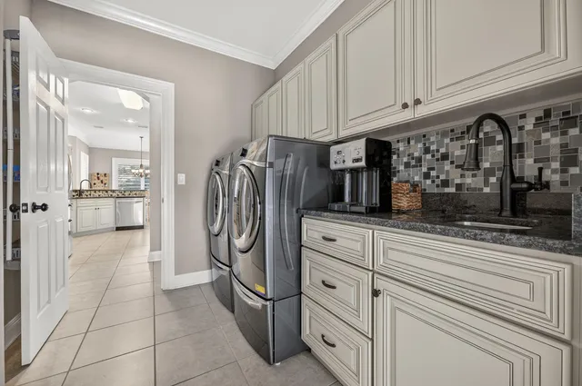a view of a patio with couches table and chairs and potted plants