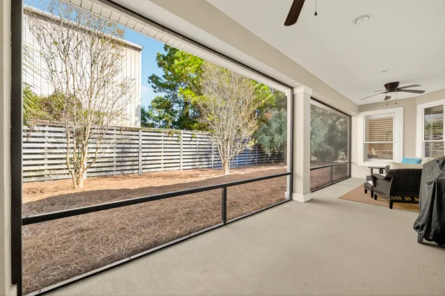 a gym area with gym equipment and a large window