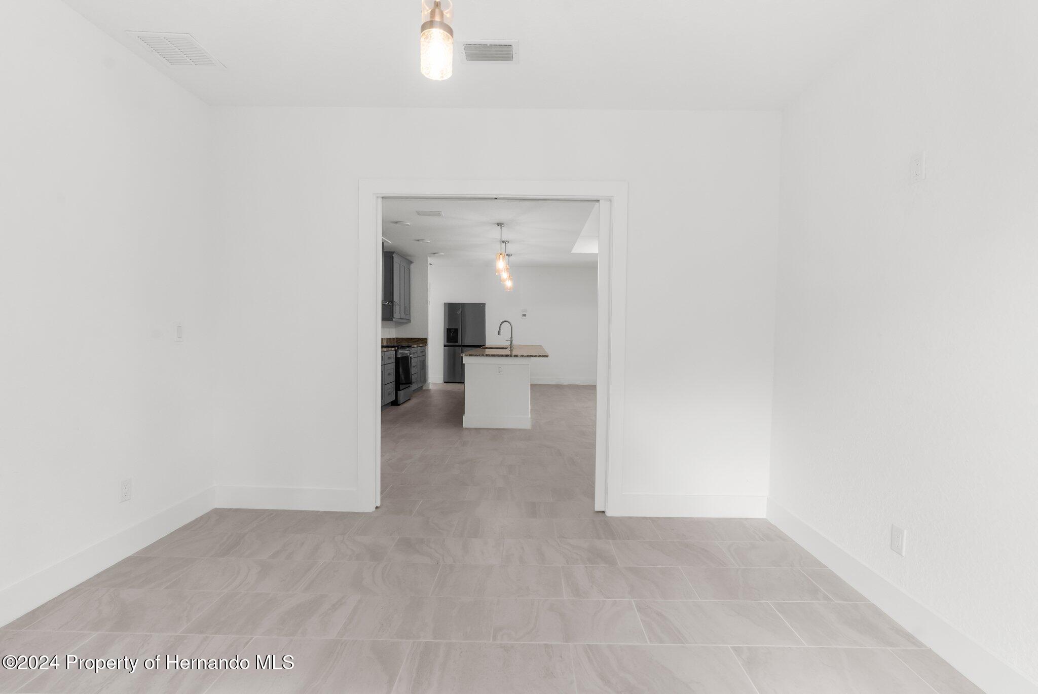 15214 Mt Sparrow Road Brooksville, FL 34614 - Photo 22 of 36 a view of a kitchen with a sink