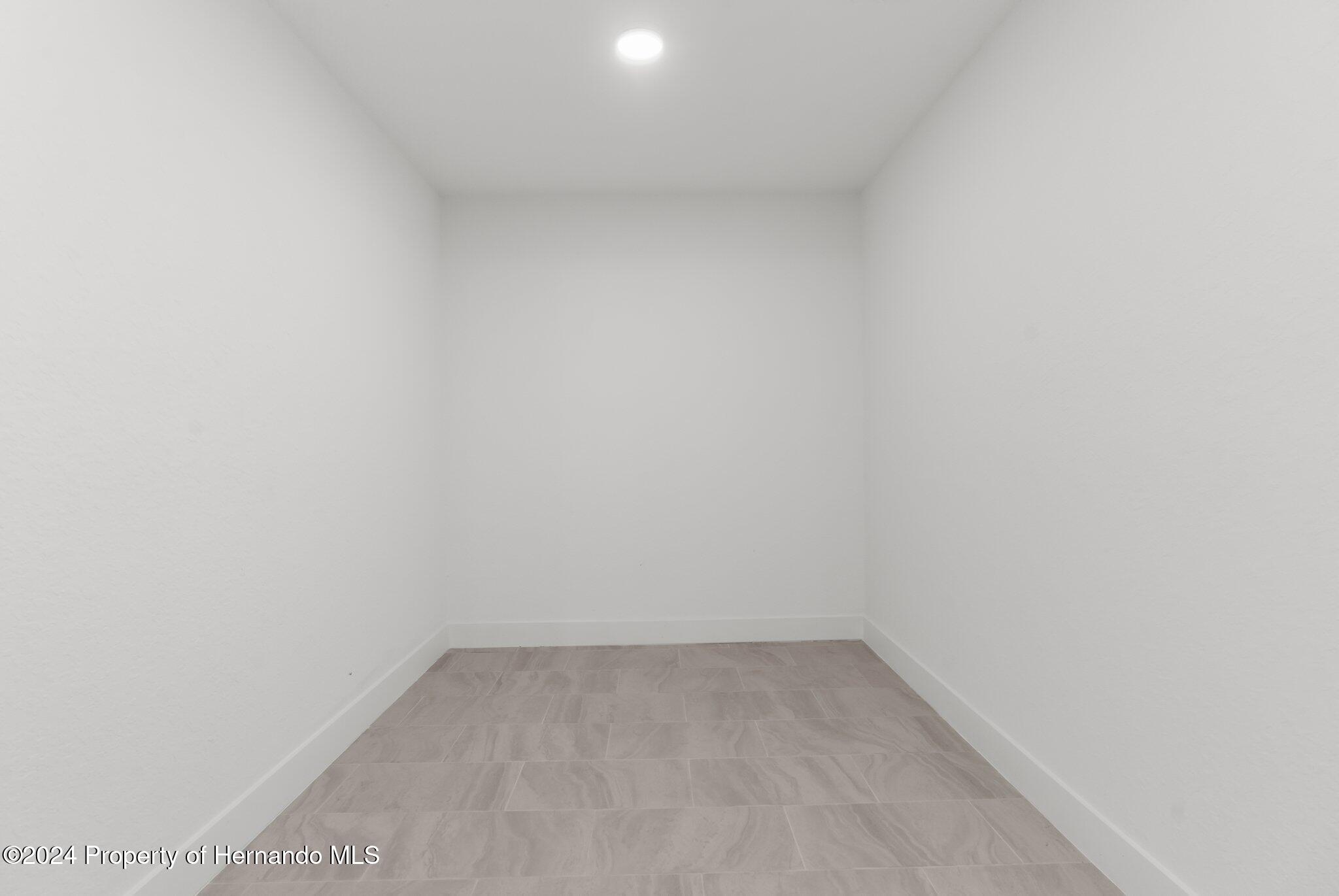 15214 Mt Sparrow Road Brooksville, FL 34614 - Photo 26 of 36 a view of an empty room