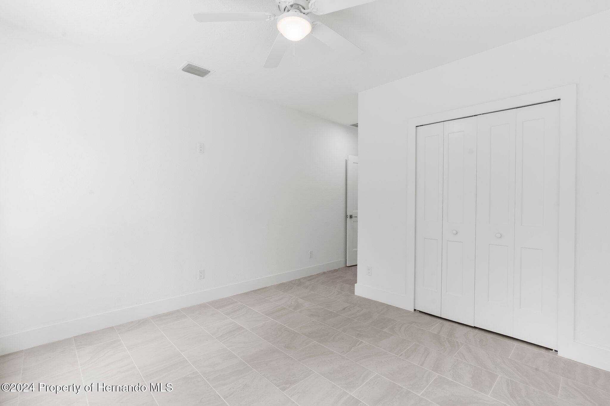15214 Mt Sparrow Road Brooksville, FL 34614 - Photo 29 of 36 a view of an empty room