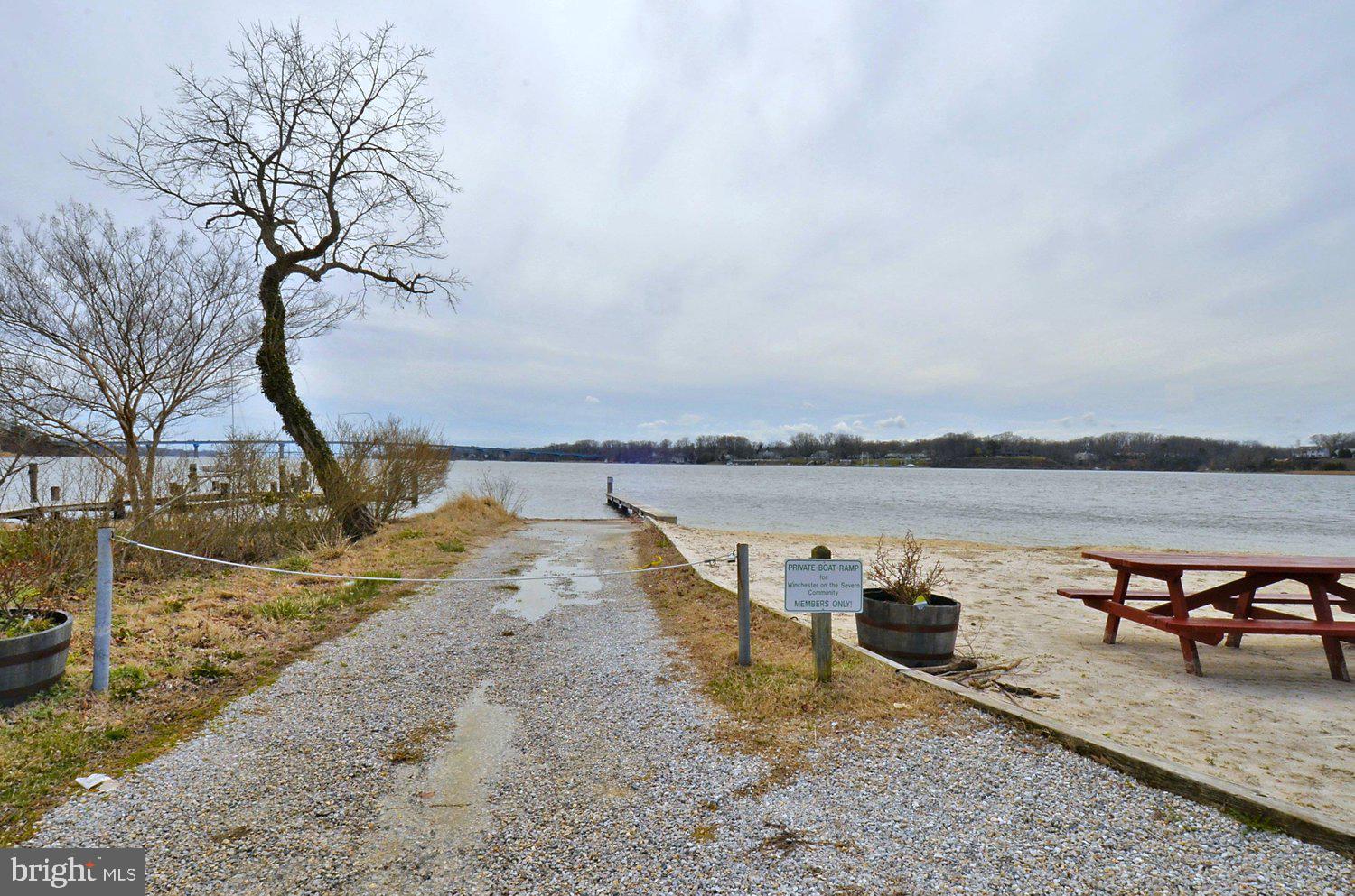 1518 Winchester Road Annapolis, MD 21409 - Photo 48 of 70 a view of a lake with a table and chair