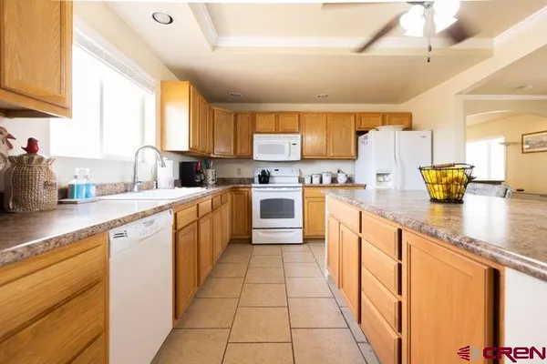 a kitchen with stainless steel appliances a sink stove and cabinets