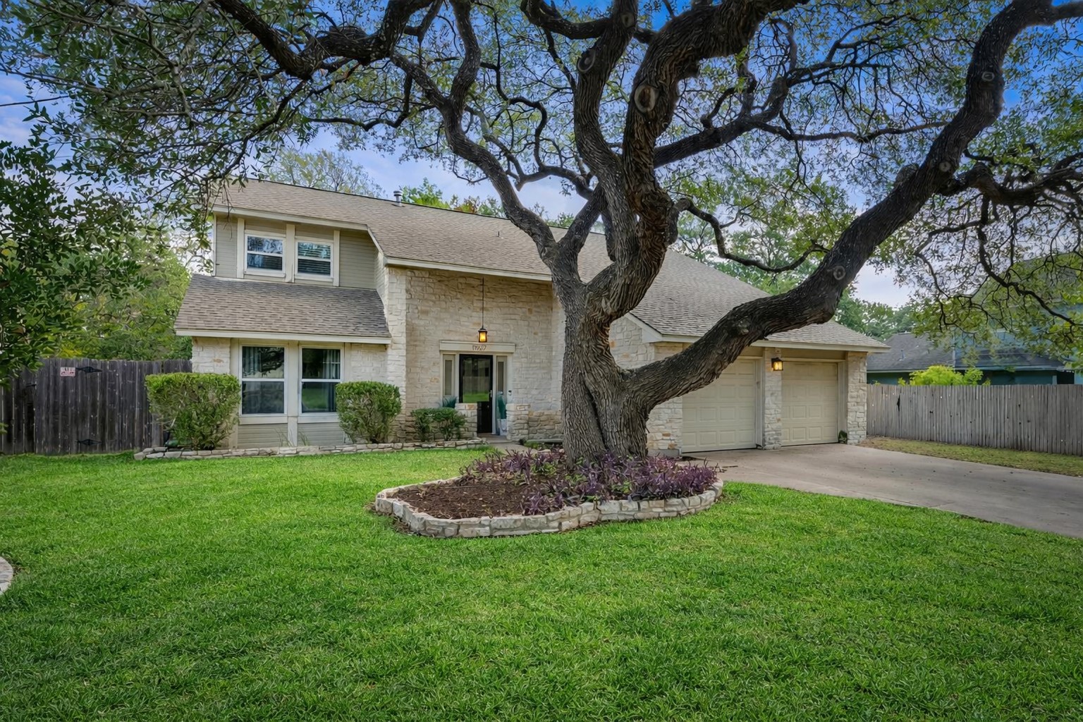 11927 Bittern Hollow Austin, TX 78758 - Photo 1 of 1 a front view of a house with a garden