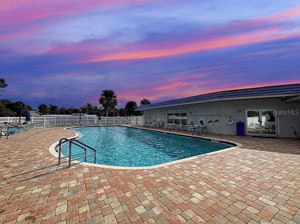 6000 Teahouse Road Venice, FL 34293 - Photo 12 of 13 a view of a swimming pool with a yard