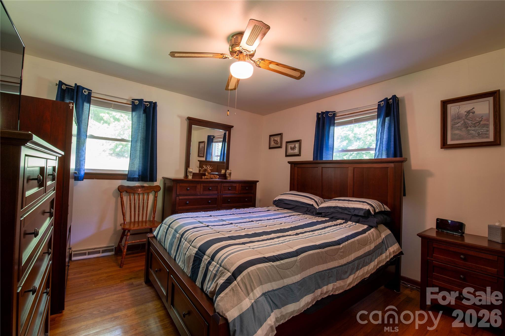 40 Double Island Road Burnsville, NC 28714 - Photo 21 of 38 a bedroom with bed and flat tv