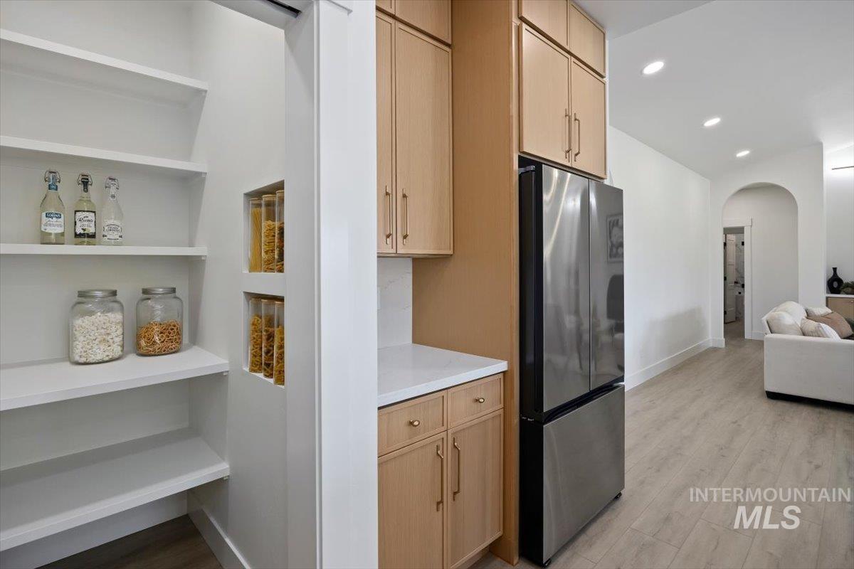 2005 Sparrow Street Rupert, ID 83350 - Photo 13 of 30 Integrated pantry storage with white shelving and recessed display niches