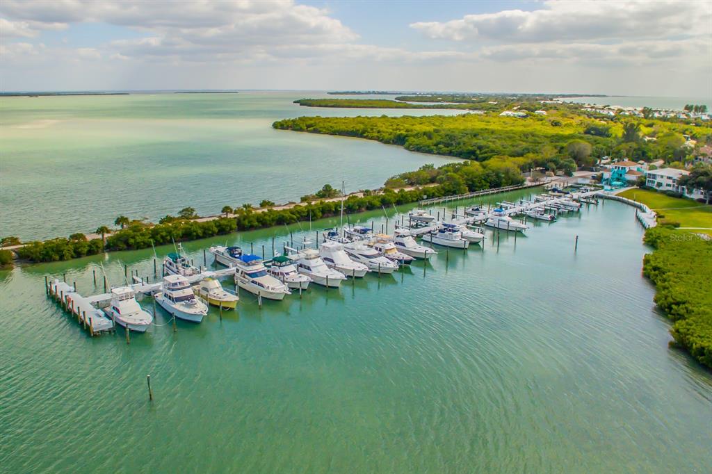 5820 Gasparilla Road, Unit 12 Boca Grande, FL 33921 - Photo 1 of 1 a view of an ocean and houses with outdoor space