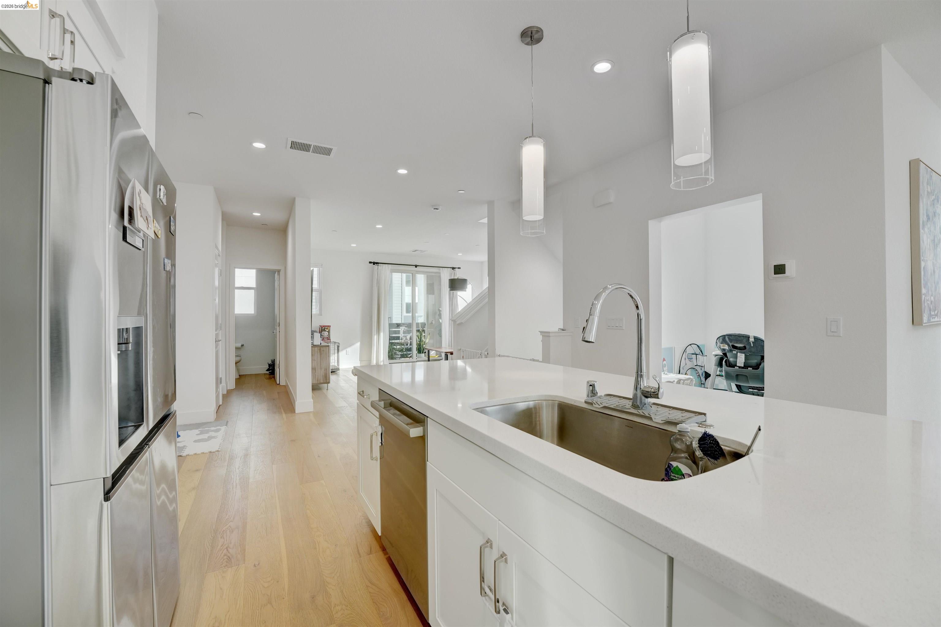 7101 Melon Court San Ramon, CA 94583 - Photo 31 of 58 a kitchen with stainless steel appliances granite countertop a sink and a refrigerator