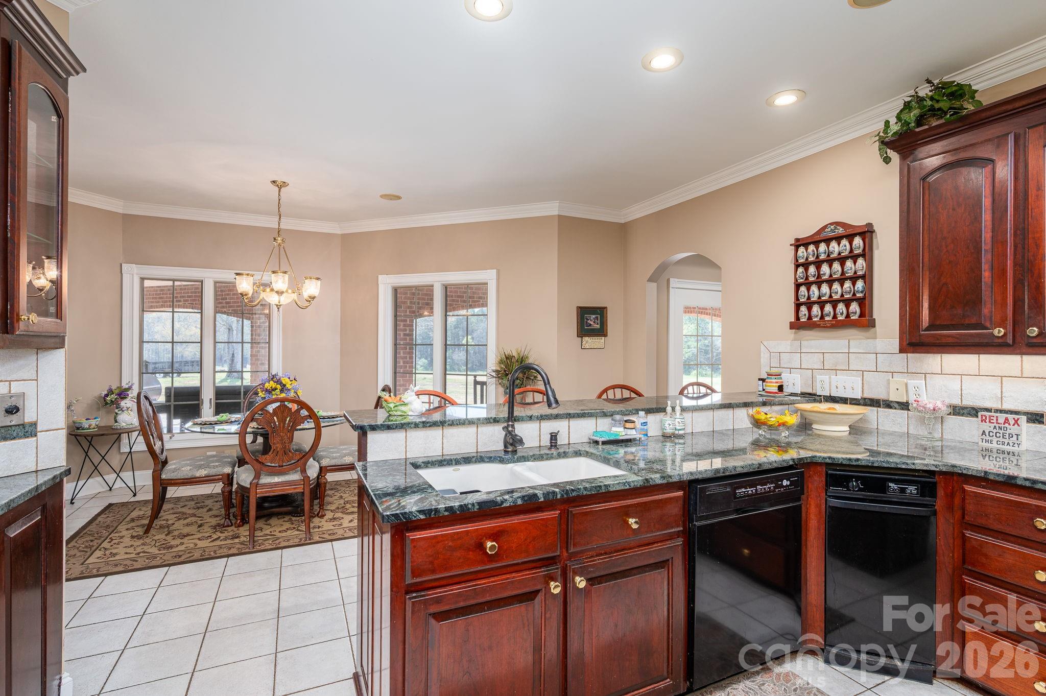 109 Wright Road Kings Mountain, NC 28086 - Photo 13 of 36 a kitchen with granite countertop a sink stove and cabinets