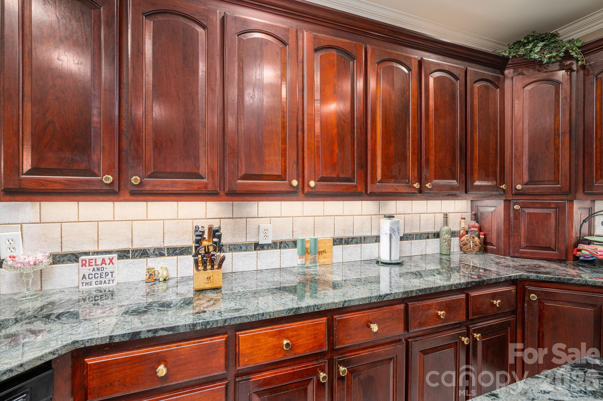 109 Wright Road Kings Mountain, NC 28086 - Photo 15 of 36 a kitchen with granite countertop stainless steel appliances granite countertop wooden cabinets a sink and dishwasher
