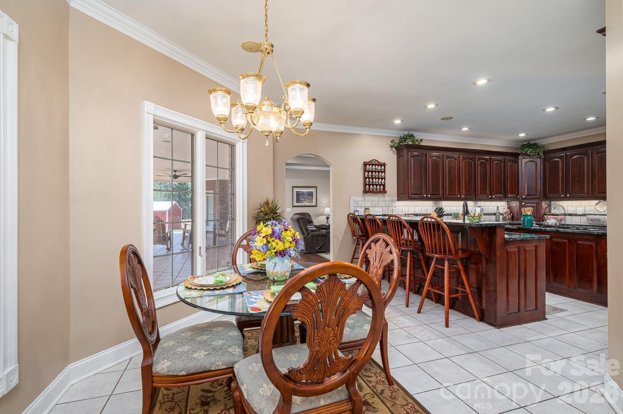 109 Wright Road Kings Mountain, NC 28086 - Photo 16 of 36 a dining room filled chandelier and kitchen view
