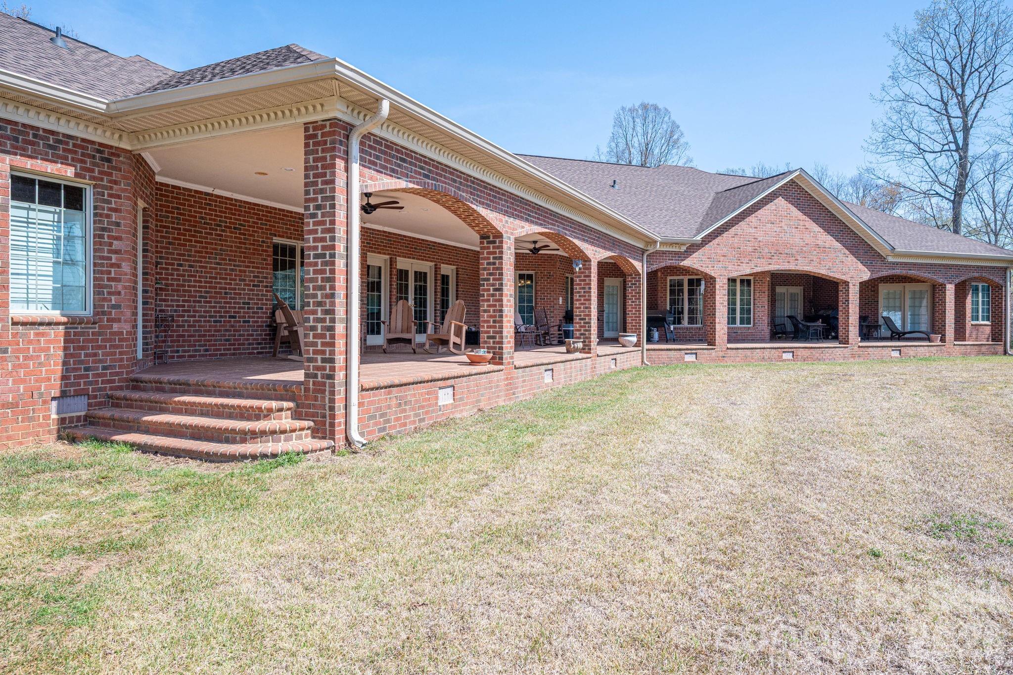 109 Wright Road Kings Mountain, NC 28086 - Photo 34 of 36 a front view of a house with a yard table and chairs