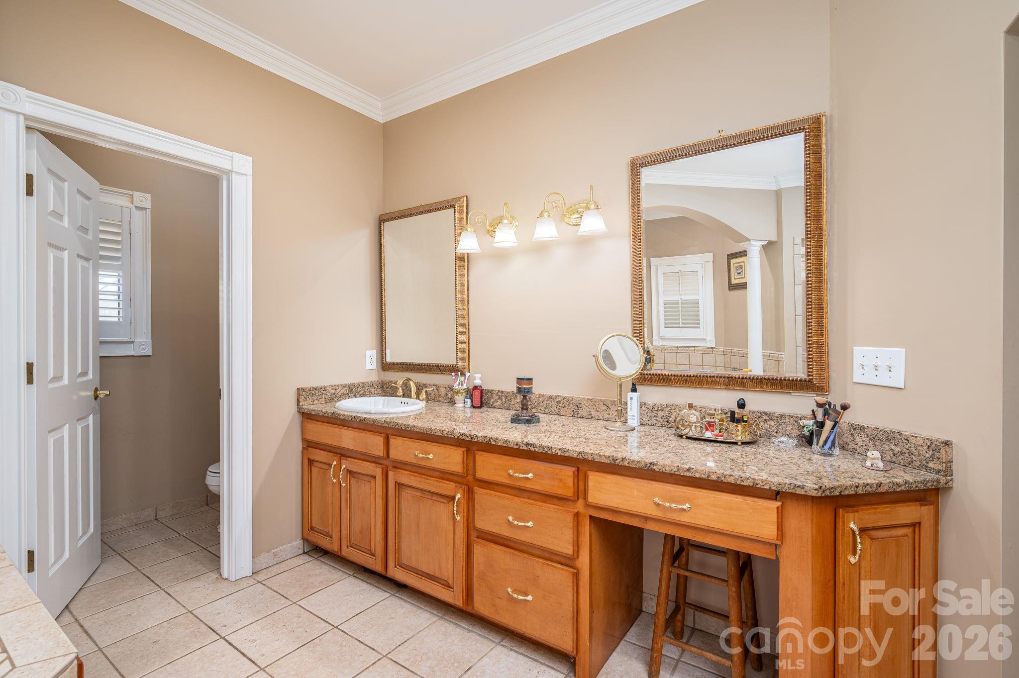 109 Wright Road Kings Mountain, NC 28086 - Photo 4 of 36 a bathroom with a granite countertop double vanity sink and a mirror