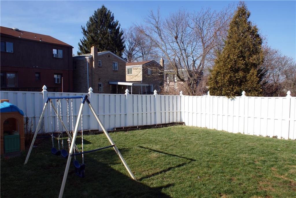 4274 Glen Lytle Road Greenfield, PA 15217 - Photo 17 of 25 Ideal for pets and children, the backyard is enveloped in a vinyl privacy fence. You can open the family room's French doors to let the kids and pets play in the back.