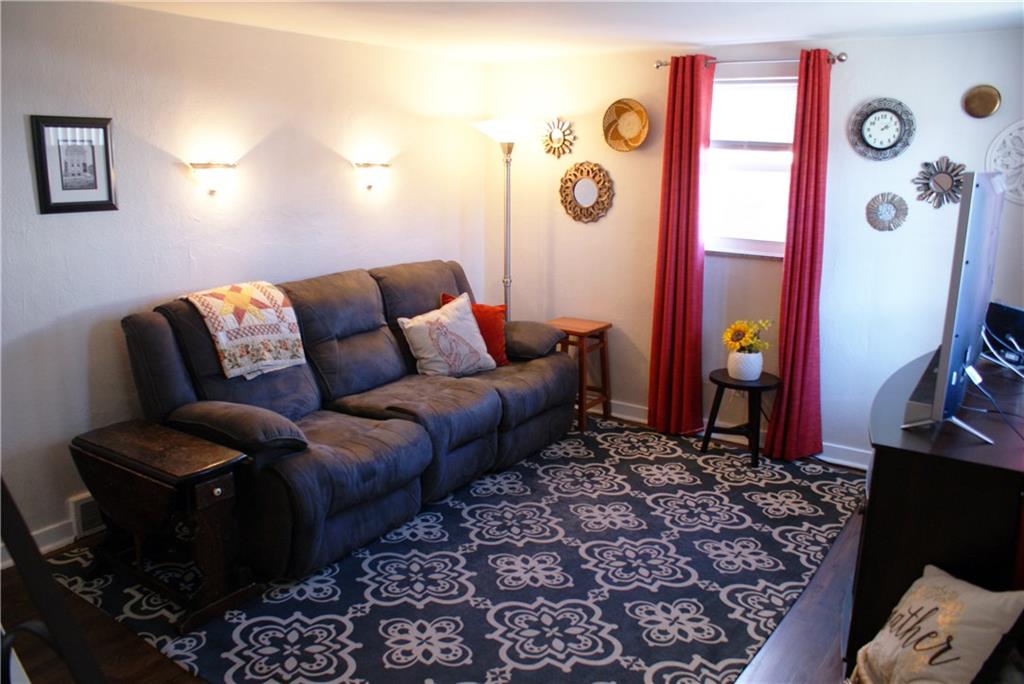 4274 Glen Lytle Road Greenfield, PA 15217 - Photo 3 of 25 The living room has two large windows, flooding the space with natural light.