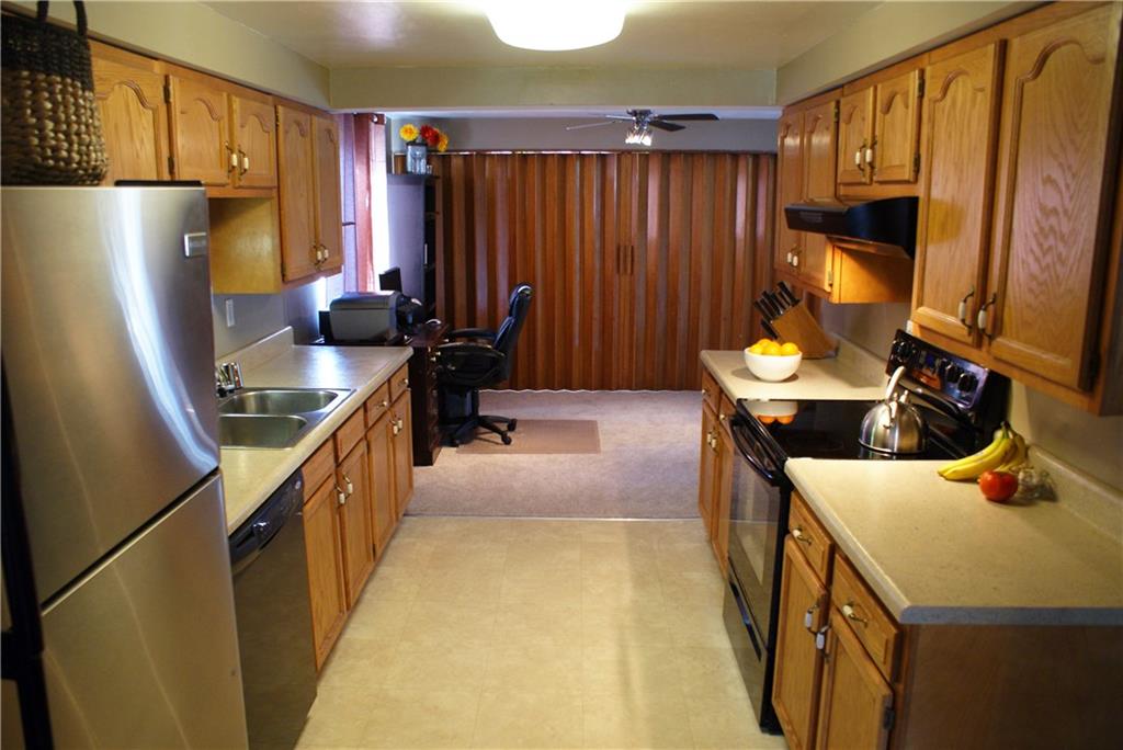 4274 Glen Lytle Road Greenfield, PA 15217 - Photo 9 of 25 The galley-style kitchen offers ample storage and workspace.