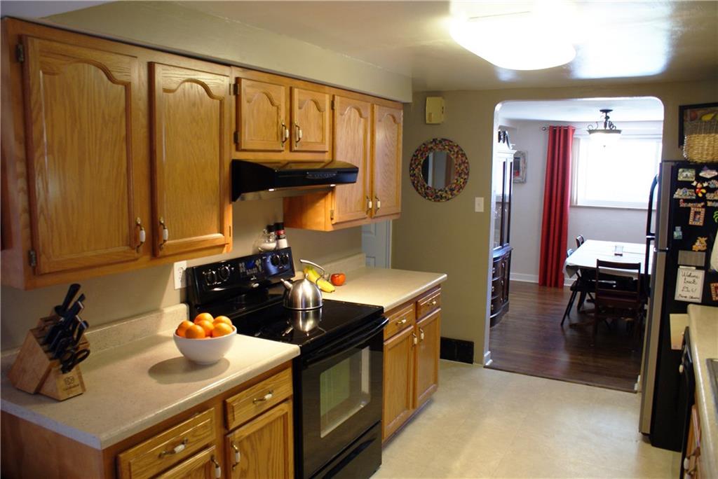 4274 Glen Lytle Road Greenfield, PA 15217 - Photo 10 of 25 Natural light funnels from the dining and family rooms to light up the kitchen.