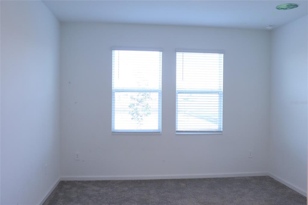 34558 Shellback Street Leesburg, FL 34788 - Photo 15 of 36 an empty room with a window