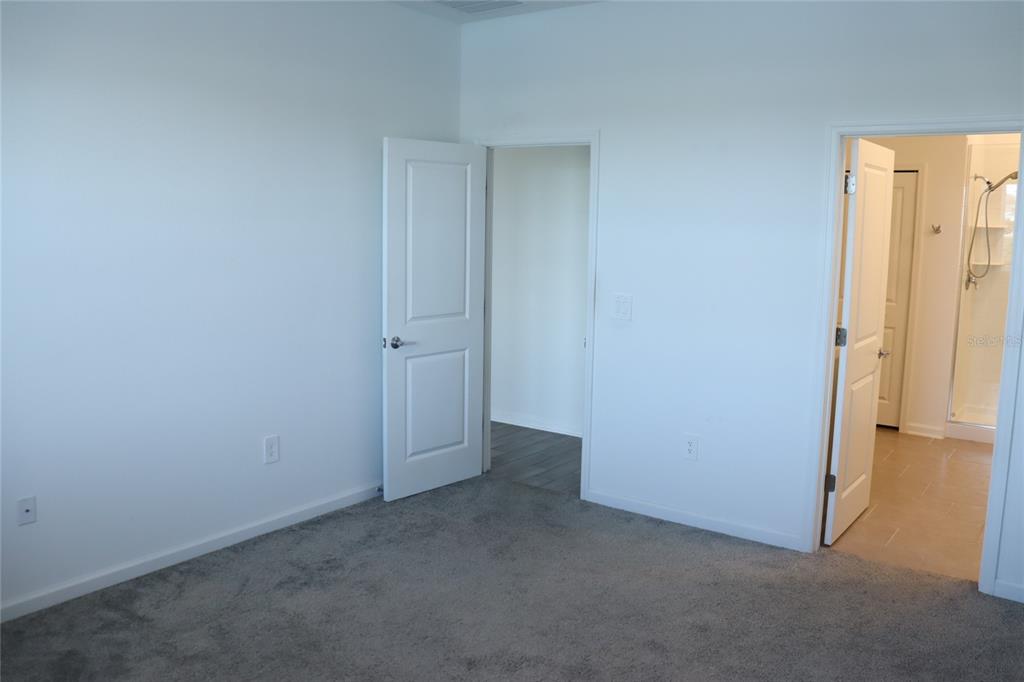 34558 Shellback Street Leesburg, FL 34788 - Photo 16 of 36 an empty room with windows