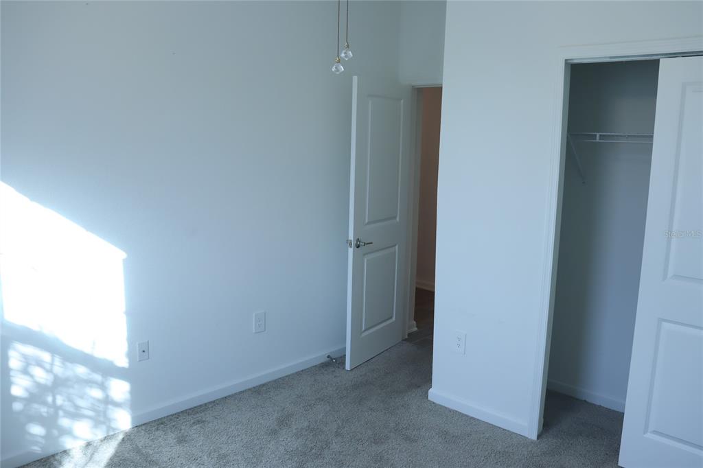34558 Shellback Street Leesburg, FL 34788 - Photo 26 of 36 a view of an empty room
